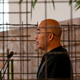 Chinese writer Liao Yiwu stands behind a cage symbolizing his political imprisonment as he delivers a speech after receiving the Frankfurt book fair's peace prize in 2012.